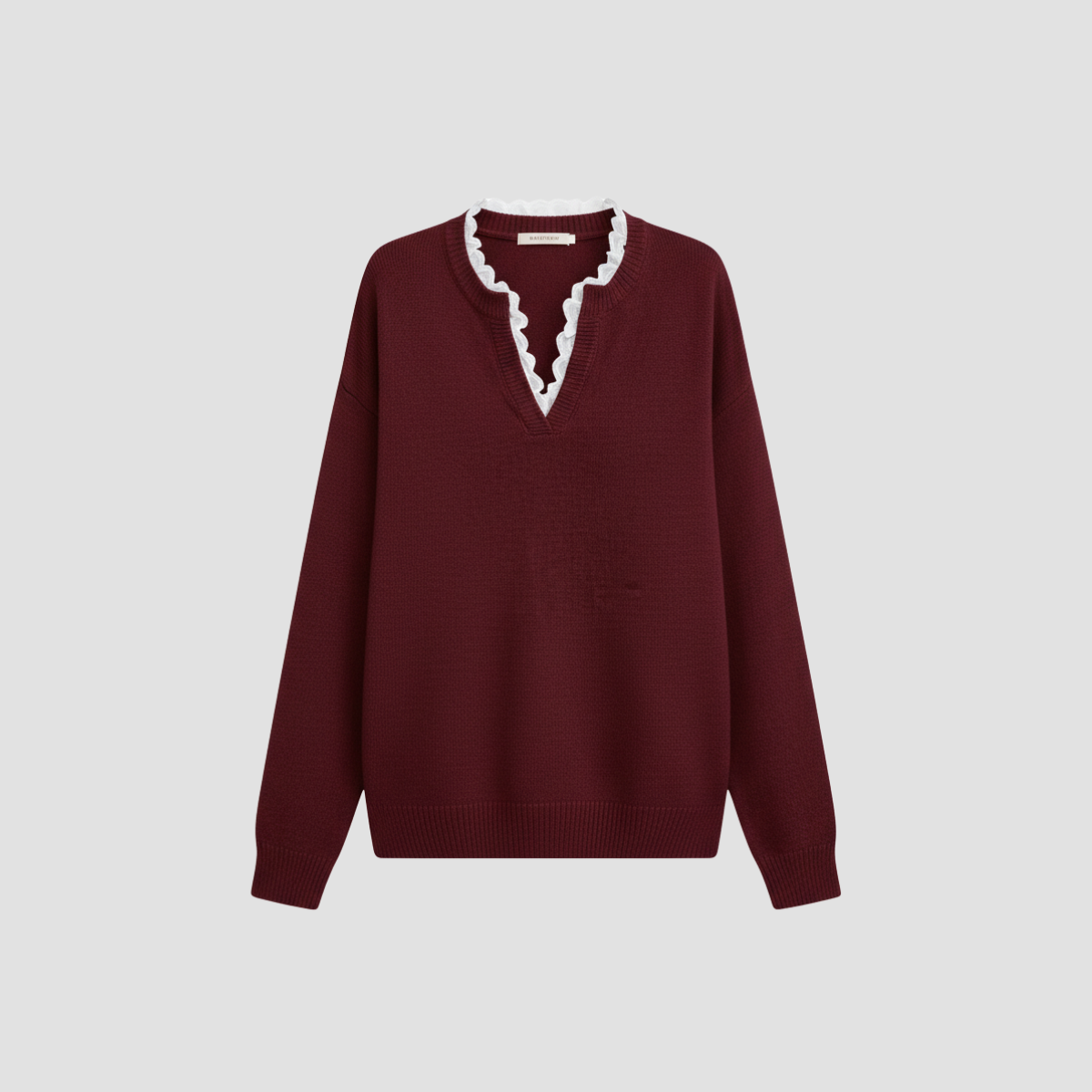 Pull tricoté pour femmes avec bord ondulé et col roulé élégant