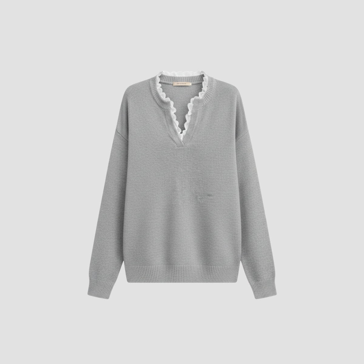 Pull tricoté pour femmes avec bord ondulé et col roulé élégant