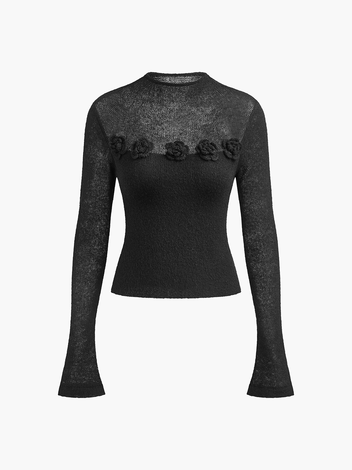 Sort striktrøje med lange ærmer og blomsterdetaljer på brystet. Elegant og stilfuldt design, perfekt til modebevidste kvinder.