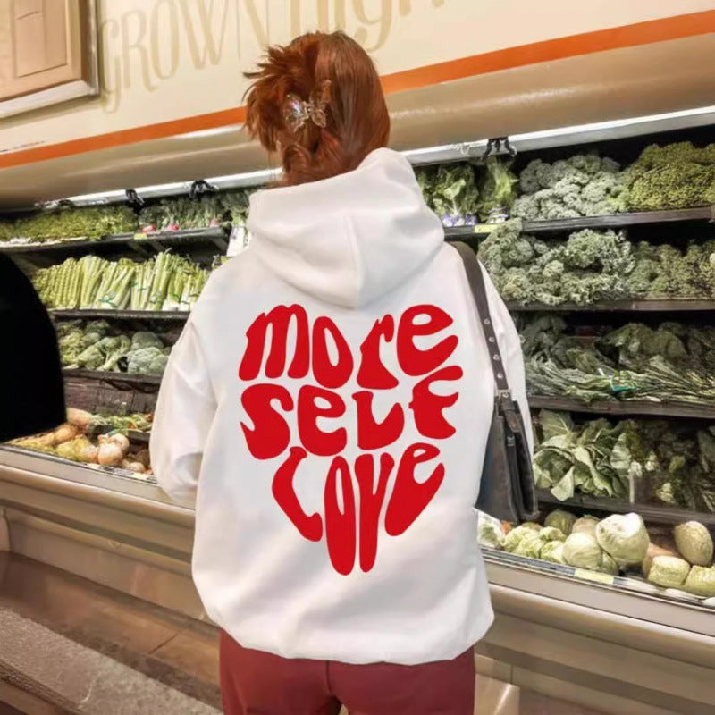 Dámská mikina s kapucí s nápadným potiskem a oversized střihem