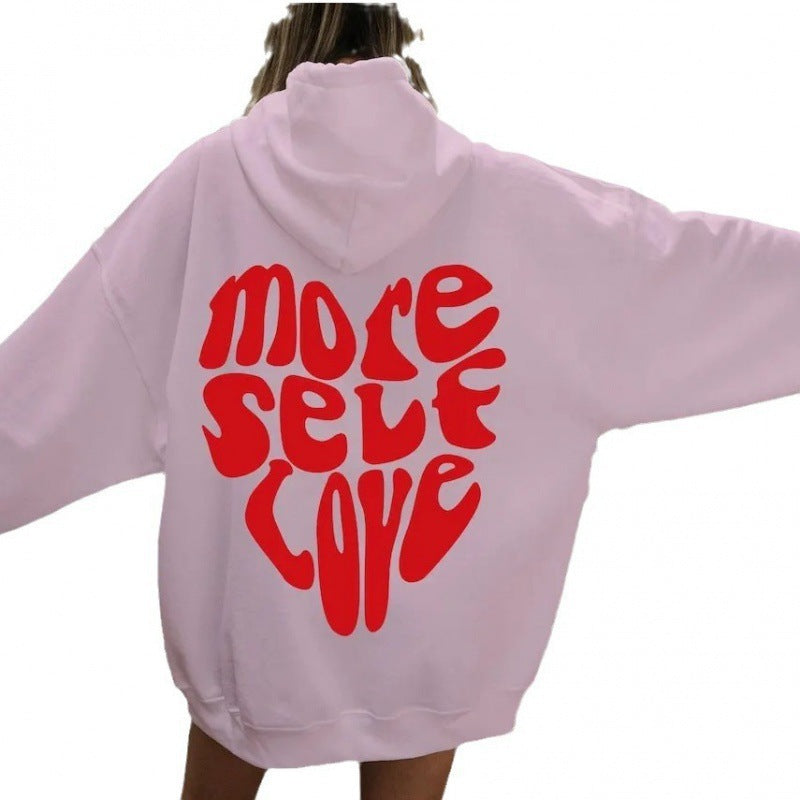 Dámská mikina s kapucí s nápadným potiskem a oversized střihem
