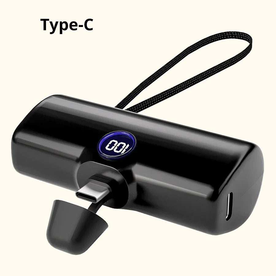 Sort Type-C powerbank med digitalt display og håndledsrem. Kompakt oplader til smartphones, bærbar og praktisk til rejser.