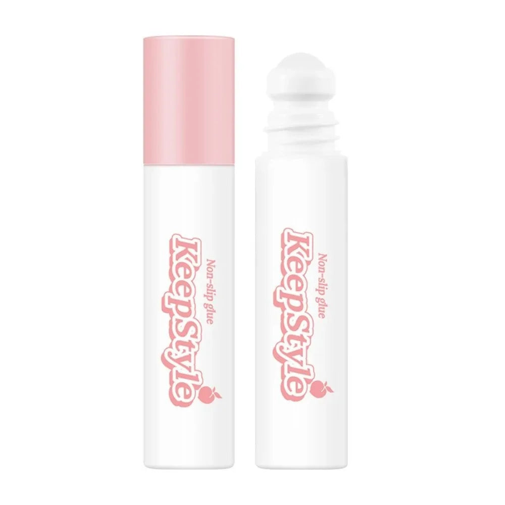 Hvid og lyserød non-slip limstift fra KeepStyle med rulleapplikator. Perfekt til håndværk og DIY-projekter. Praktisk og nem at bruge.