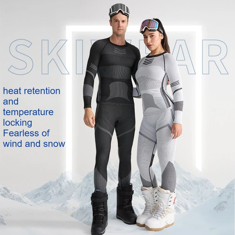 To personer i moderne skiundertøj, en mand i sort og en kvinde i grå, står foran en sneklædt baggrund. Tekst: "heat retention and temperature locking".