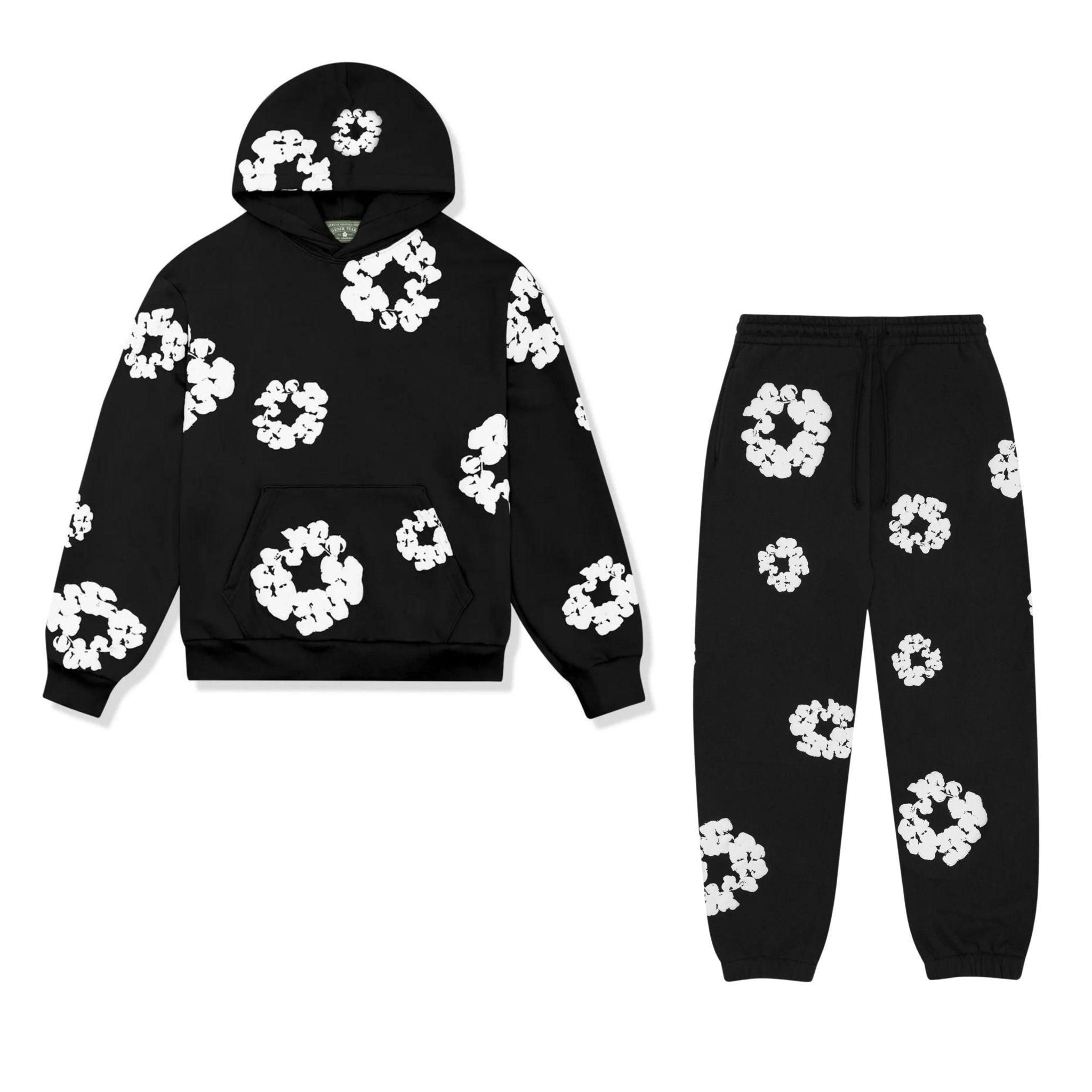 Sort hættetrøje og joggingbukser sæt med hvidt blomstermønster. Komfortabelt streetwear, ideelt til afslappet stil og modebevidste unge.
