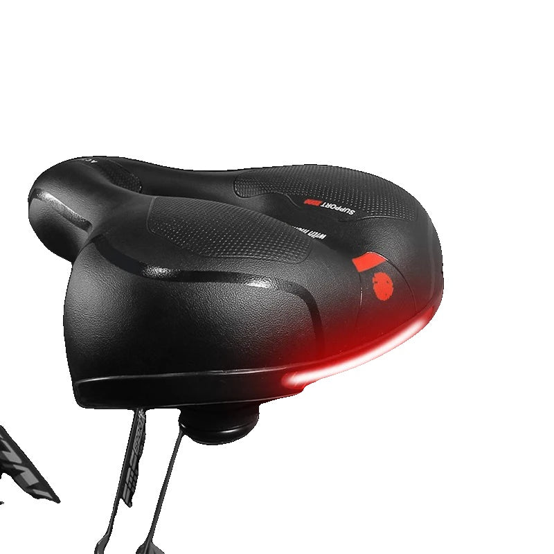 Sort cykelsadel med integreret LED-lys, ergonomisk design og stødabsorbering. Perfekt til komfortabel og sikker cykling i mørke.