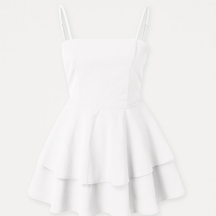 White mini dress with overlapping ruffles, spaghetti straps and airy cut