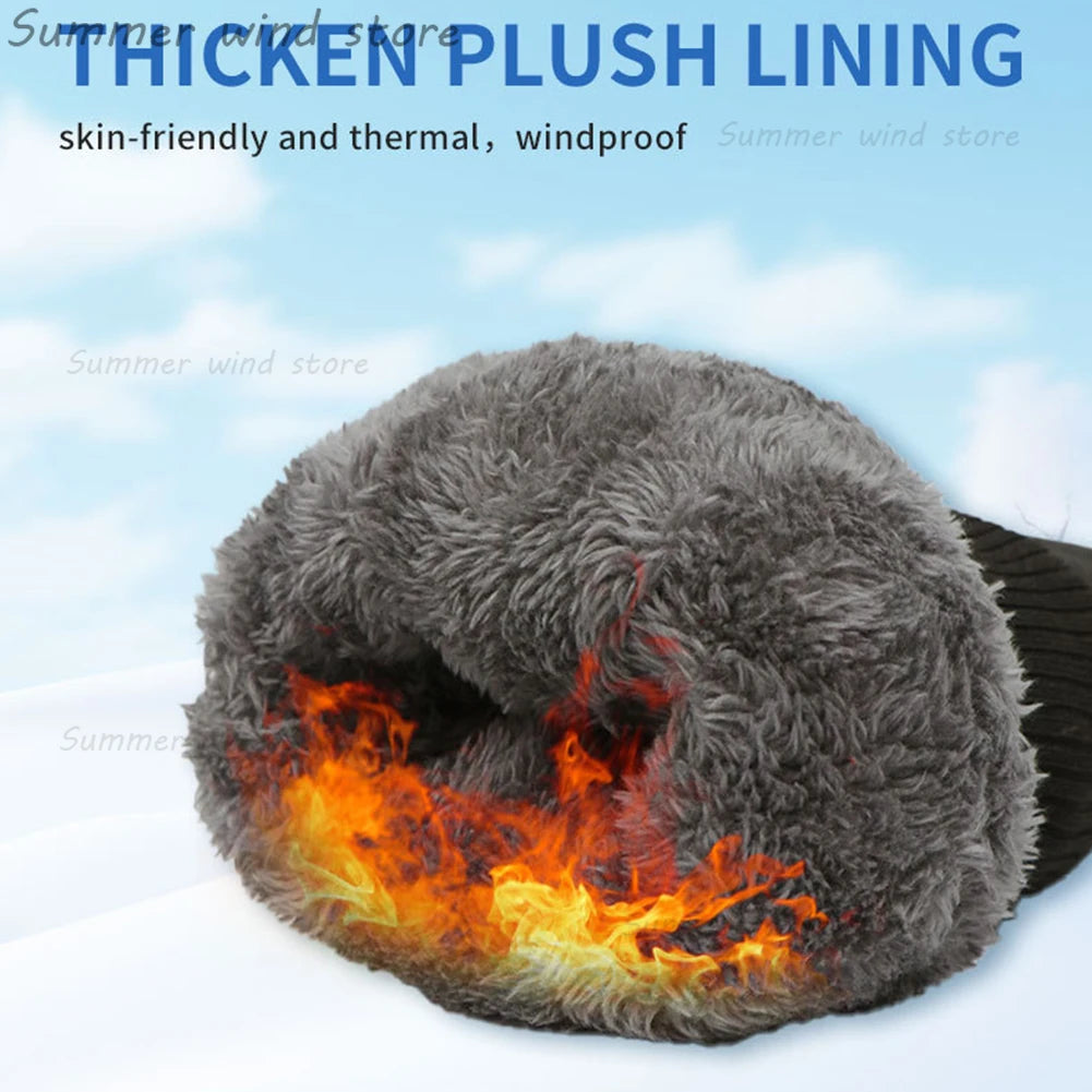 Grå, tyk plysforet handske med vindafvisende egenskaber, der fremhæver varmeisolering. Perfekt til vinterbrug og udendørs aktiviteter.