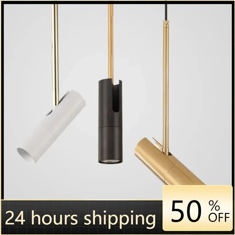 Tre moderne pendellamper i hvid, sort og guld hænger fra loftet. Minimalistisk design, 50% rabat, hurtig 24-timers levering.