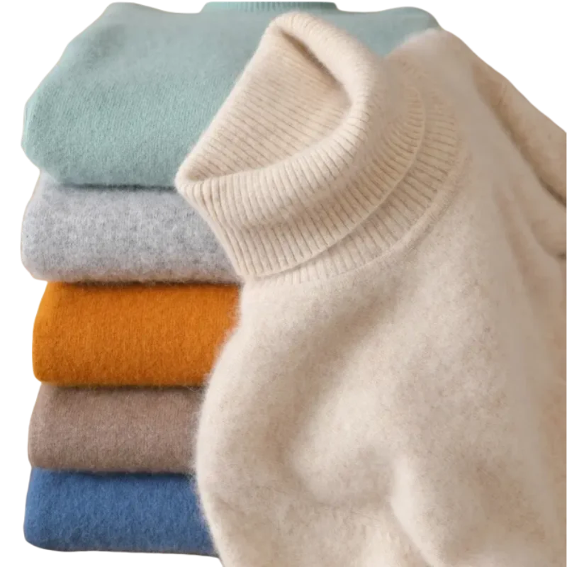Stabel af farverige kashmirtrøjer med rullekrave i beige, blå, grå, orange og brun. Bløde, luksuriøse materialer til vintermode.