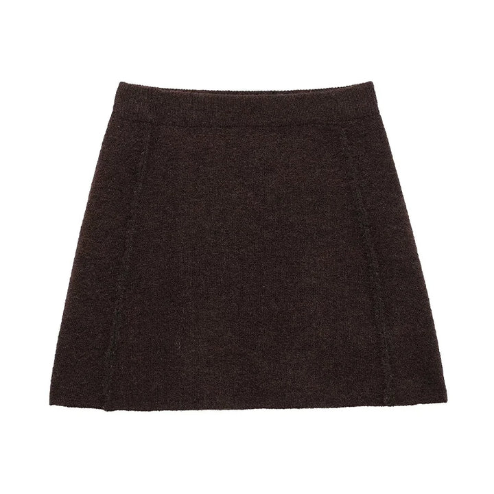 Brun uldnederdel til kvinder, kort A-line design, minimalistisk stil, perfekt til efterår og vintermode. Komfortabel og stilfuld beklædning.