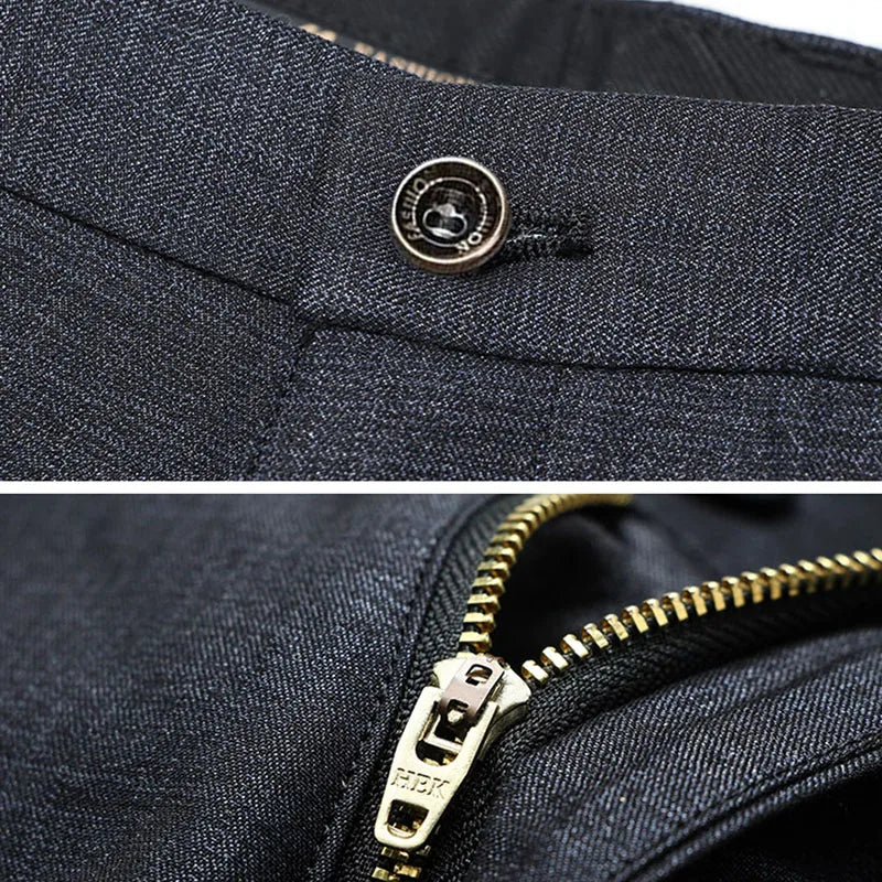 Mørkegrå bukser med lynlås og knapdetalje, herretøj, elegant design, kvalitetsmateriale, moderne stil, perfekt til formelle anledninger.