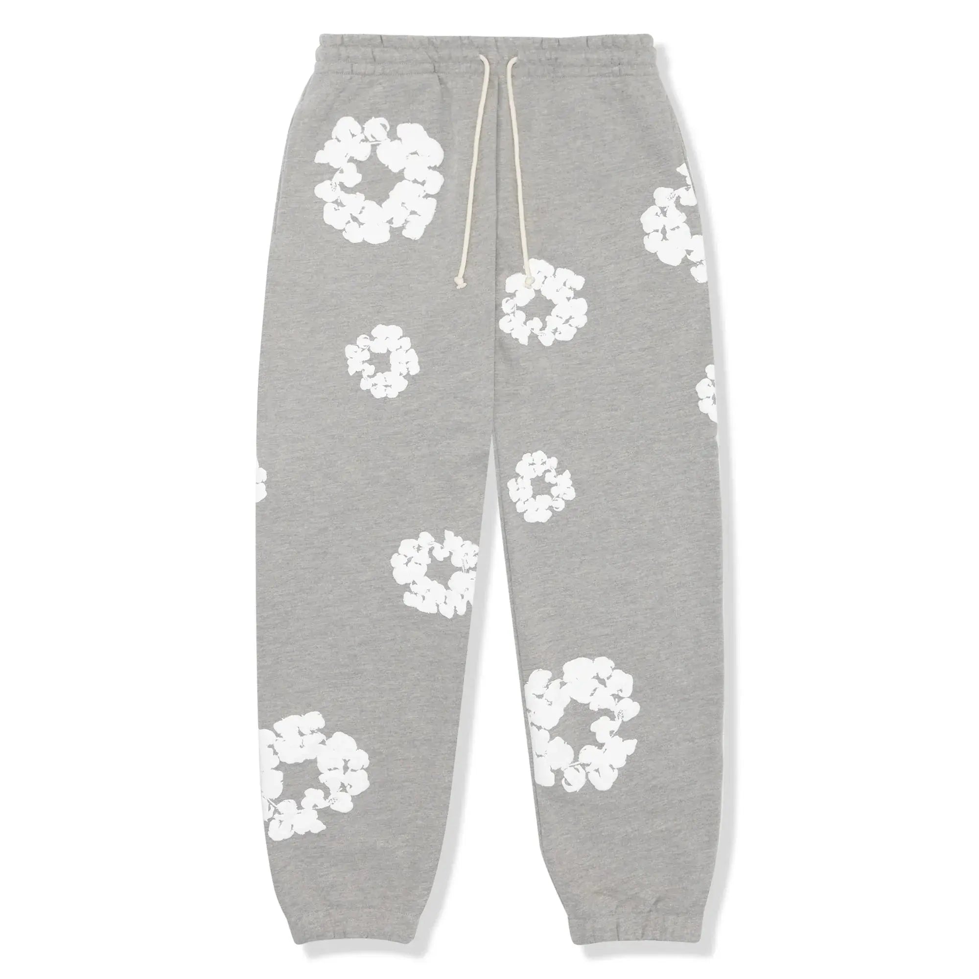 Grå sweatpants med hvide blomsterprint, elastisk talje og snøre. Komfortable joggingbukser til afslapning og hverdagsbrug.