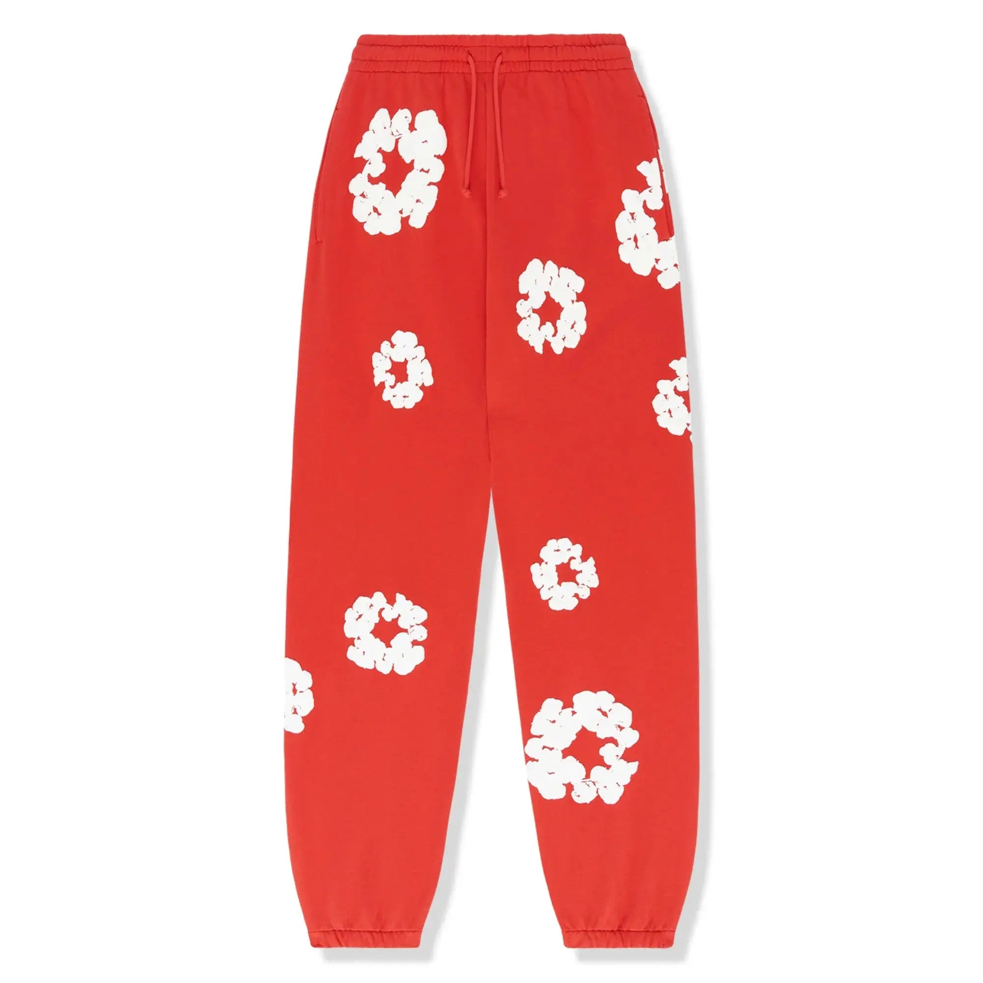 Røde joggingbukser med hvide blomsterprint, elastisk talje og manchetter. Trendy og komfortabelt design til afslappet brug.