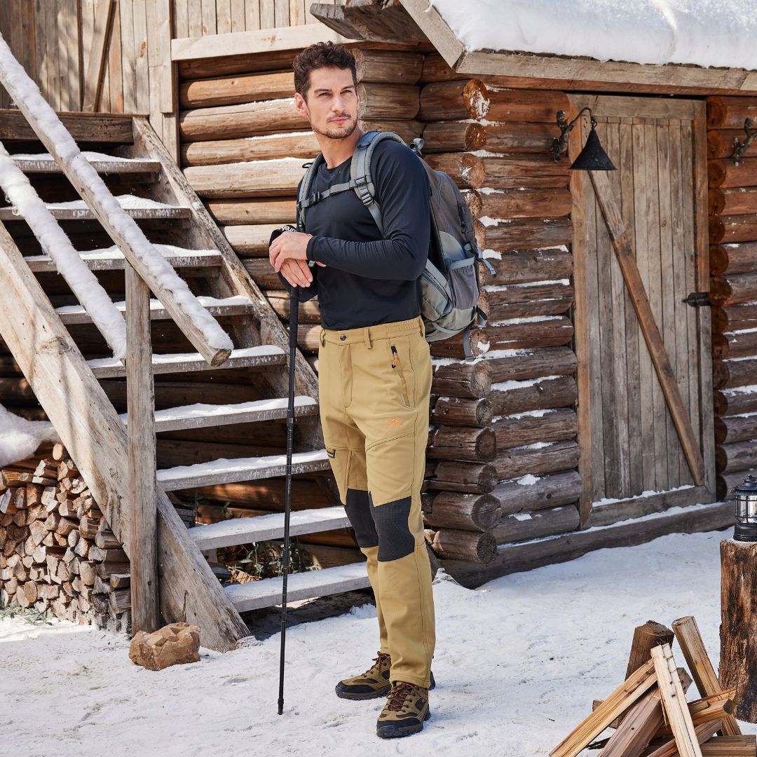 Water-resistant men's ski pants with fleece lining and reinforced knees for winter sports